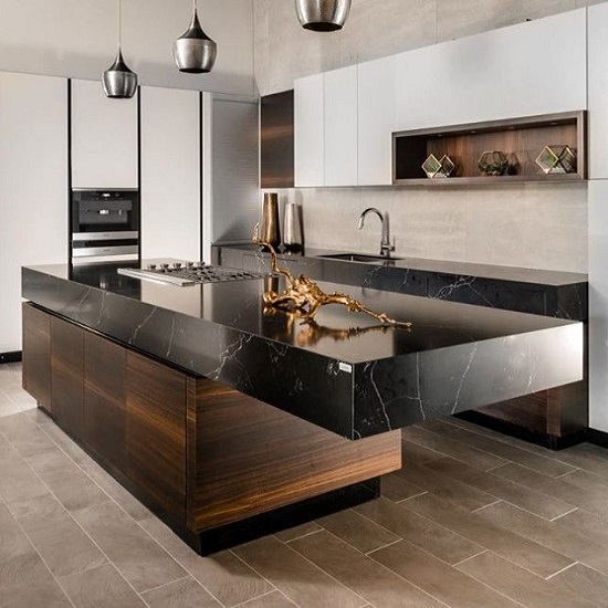 a kitchen with an island in Compac Unique Marquina quartz with built-up egdes