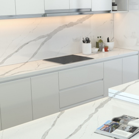 a photo of matching Unistone Arabescato worktops and splashbacks in a modern kitchen