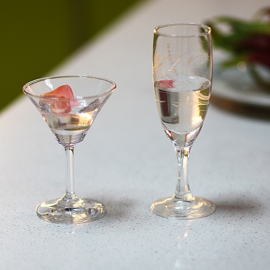 a Unistone Bianco Cristal kitchen worktop and two cocktail glasses