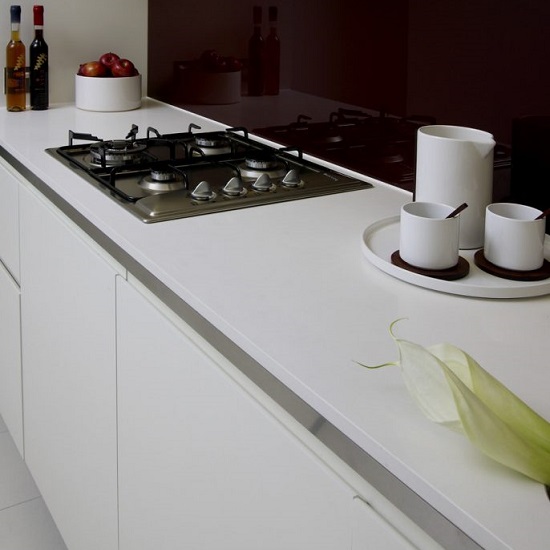 a photo of a minimalistic kitchen with a photo of a Unistone Bianco worktop