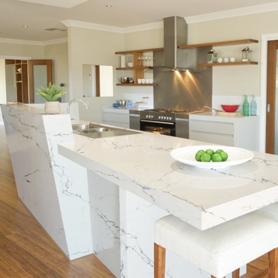 a photo of a kitchen with a Unistone Carrara Venatino quartz breakfast bar