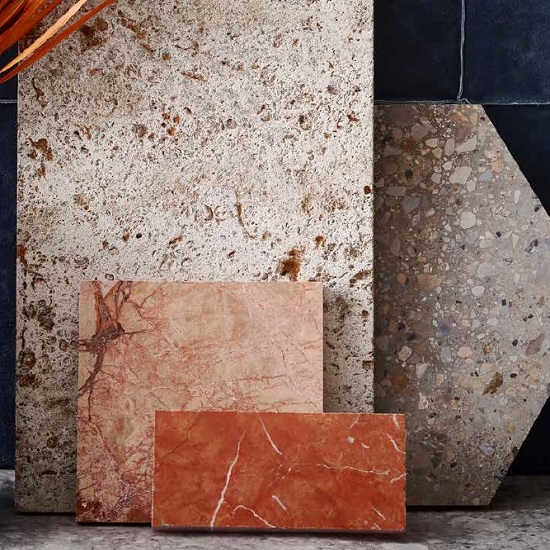 a photo of a wall with terrazzo slabs and Unistone Ceppo