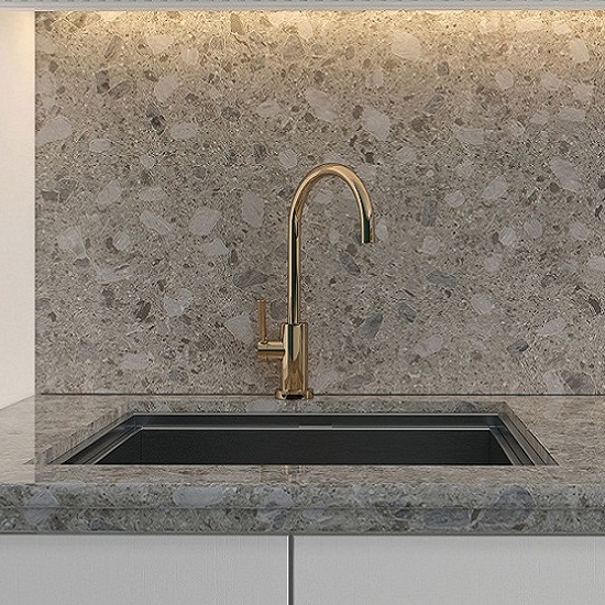 a photo of a kitchen worktop, sink and splashback in Unistone Ceppo quartz