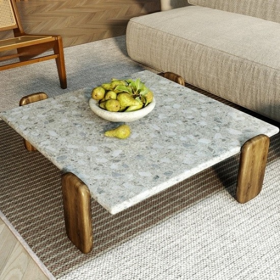 a living room with a Unistone Ceppo quartz coffee table top