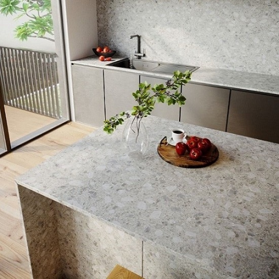 a photo of a kitchen with an island wrapped around in Unistone Ceppo 20 mm quartz