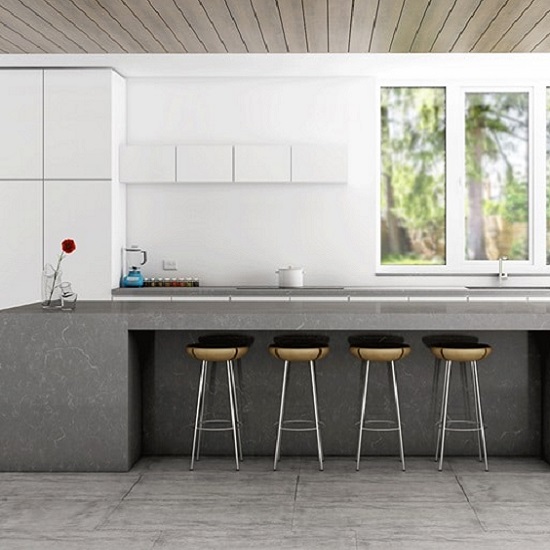 a Unistone Cinza kitchen island wrap around in a white kitchen