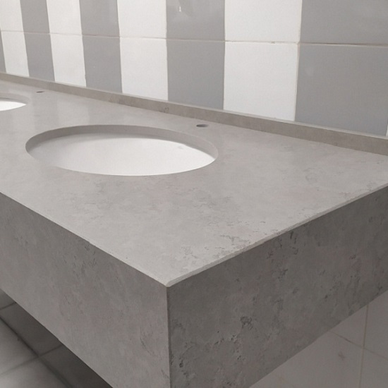 a Unistone Concreto bathroom worktop with built-up edges