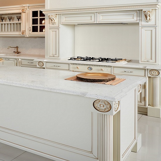 a traditional kitchen with Unistone Crema Marfil polished quartz kitchen island