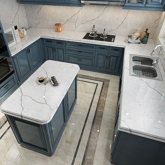 a blue kitchen with Unistone Diamant polished quartz worktops and an island