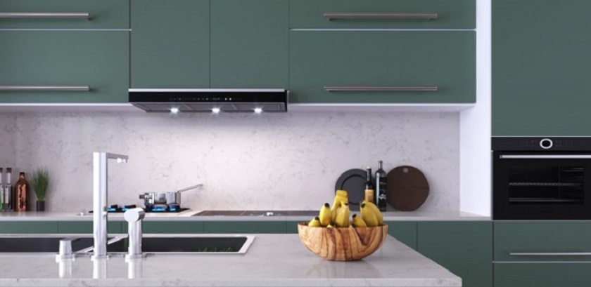 photo of a green kitchen with Unistone Hestia polished quartz worktops and splashbacks