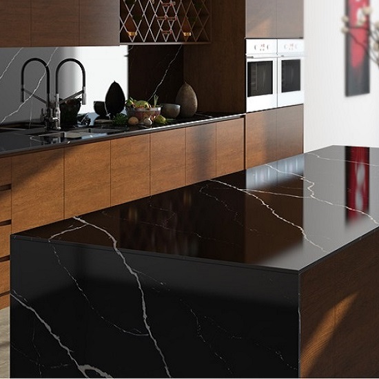 a polished Unistone Nero Marquina kitchen island in a wooden kitchen