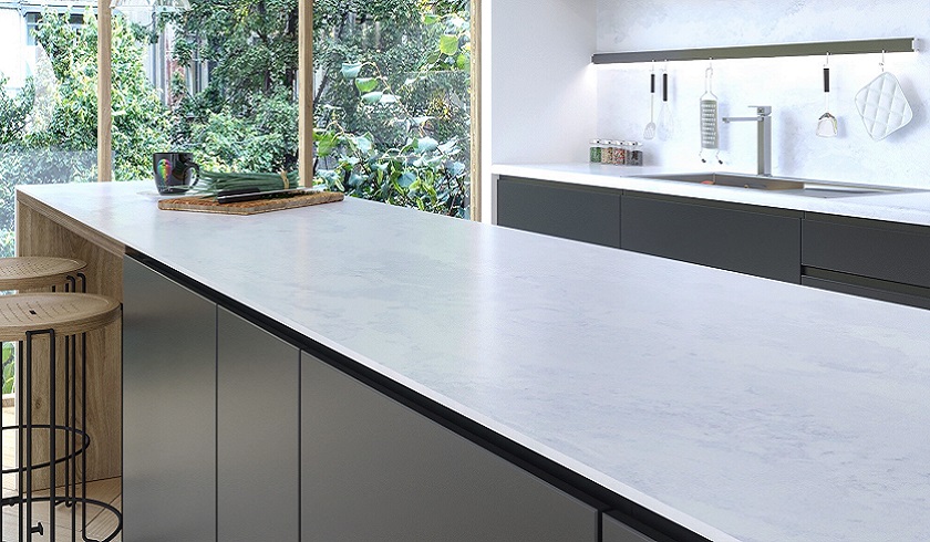 a photo of a minimalistic brown kitchen with Unistone Eden quartz on as worktops, splashbacks