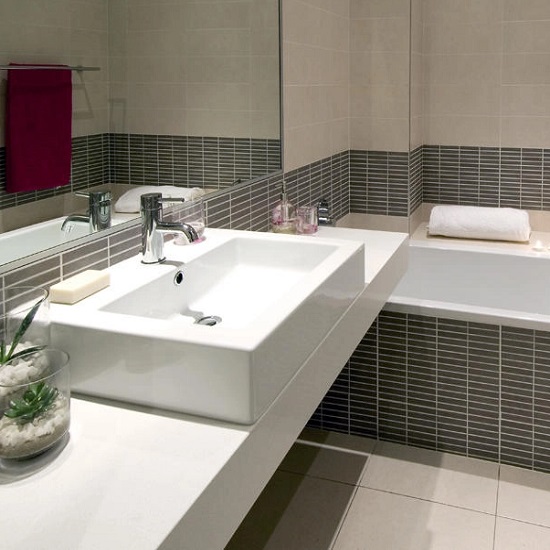 a Technistone Crystal Polar White bathroom worktop and a sink
