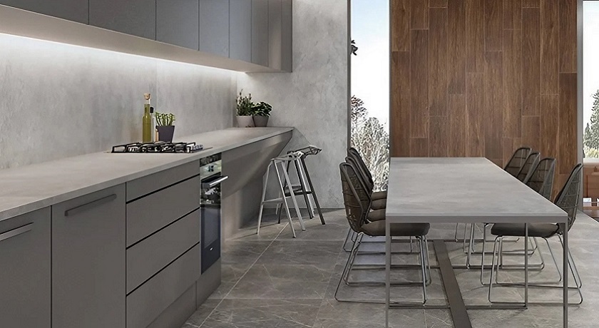 A grey kitchen with Ascale Cosmpolita Silver worktops and a matching table top