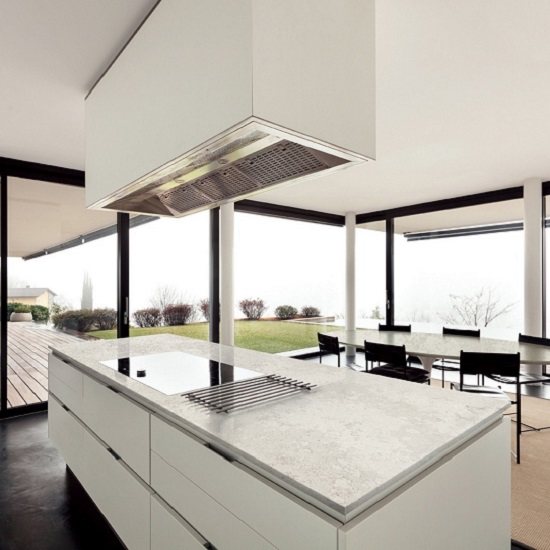 a photo of a Nile Quartz Concrete Earth kitchen island in an open plan room