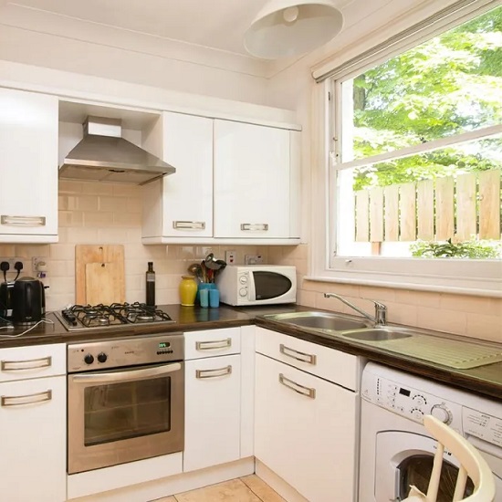 a white kitchen with Nile Quartz Royal Grey worktops