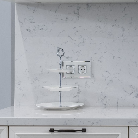a kitchen with a Nile Quartz Carrara Satin 30mm worktop and a matching splashback