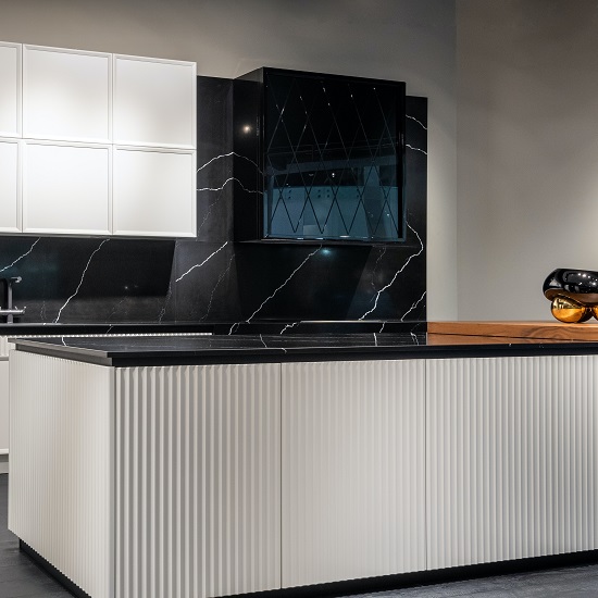 a modern kitchen with a Nile Quartz Marquina Shimmer island