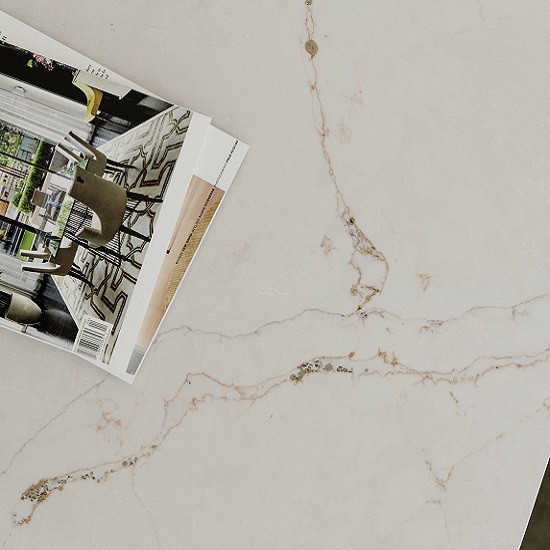 a photo of a Silestone Versailles Ivory worktop and a magazine