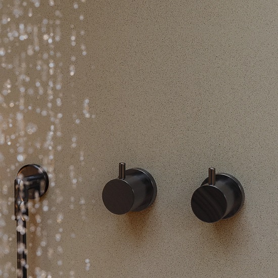 a photo of a bathroom shower cladding in Technistone Harmonia Navajo