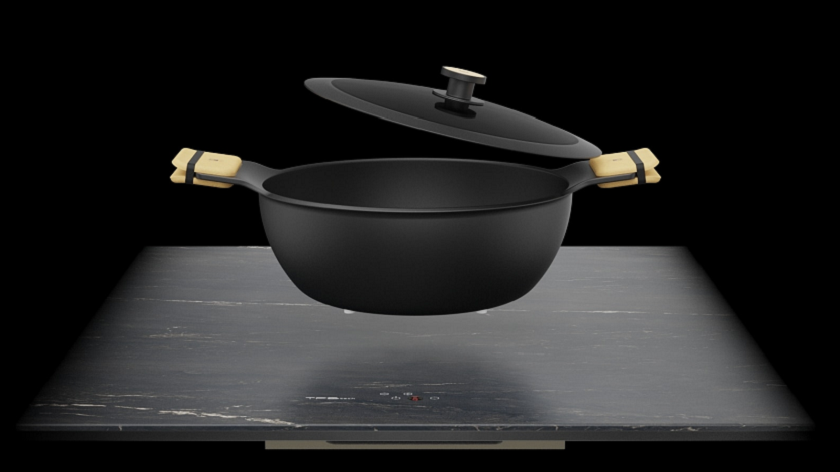 a photo showing an Ascale Belvedere Black worktop's induction cooking and a pot on top