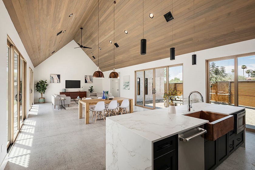 A Scandinavian kitchen with Dekton Aura worktops and a corrugated wooden ceiling
