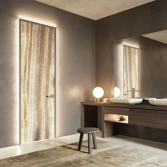 a photo of an Onyx Fantastico bathroom wall, a vanity, a lamp, and a chair