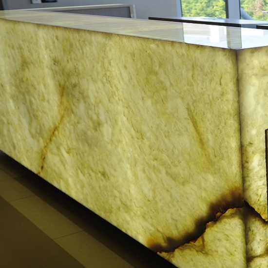 a photo of a reception desk in White Onyx