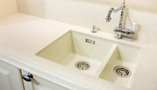 A white sink with a double sink