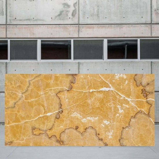 an image of an Orange Onyx slab outside stone yard