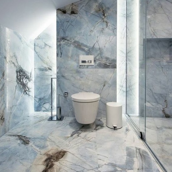 a photo of a bathroom with sky blue onyx worktops, walls and floors