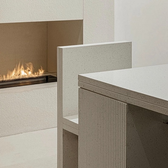 a photo of a White terrazzo worktop Ricotta next to a fireplace
