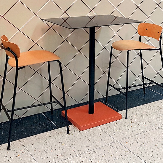 a photo of a table, two stools and Dark green terrazzo floor tiles