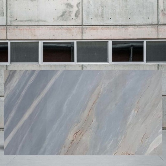 an image of a Palissandro Bluette Marble slab outside a stone yard