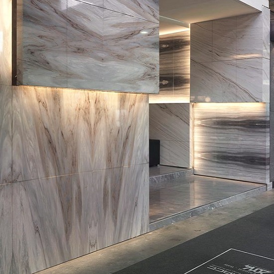 a photo room with Palissandro Bronzetto Marble wall panels