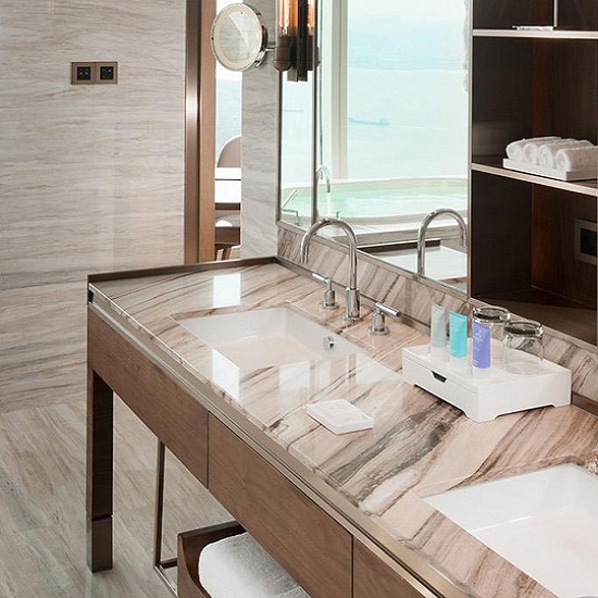a bathroom with Palissandro Fiorito Marble worktops, walls and floor