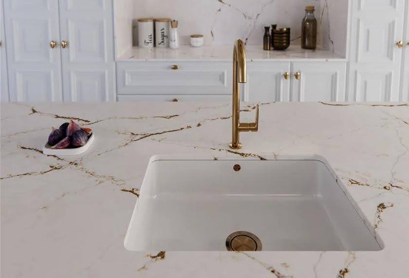 A sink on a marble countertop