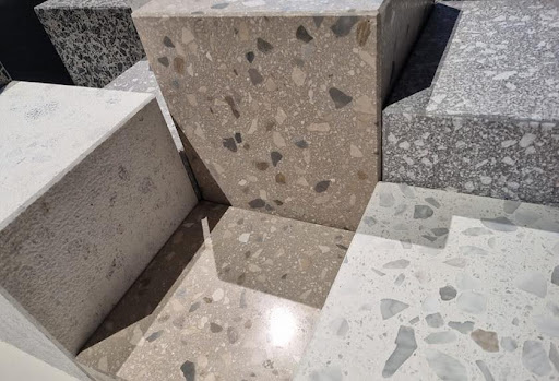 A close-up of grey terrazzo surfaces at Marmoracc exhibition by Agglotech