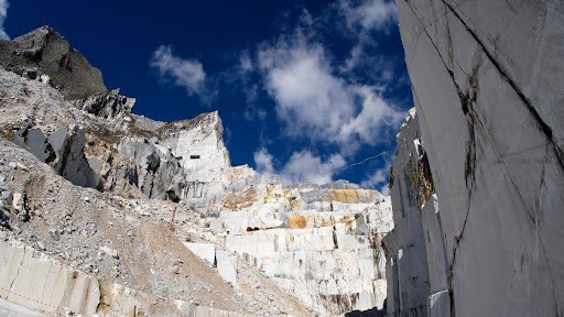 A white marble and terrazzo quarry with a blue sky