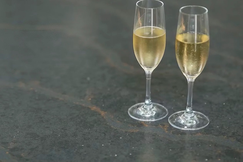 a Silestone Cinder Craze worktop and two glasses with Champagne