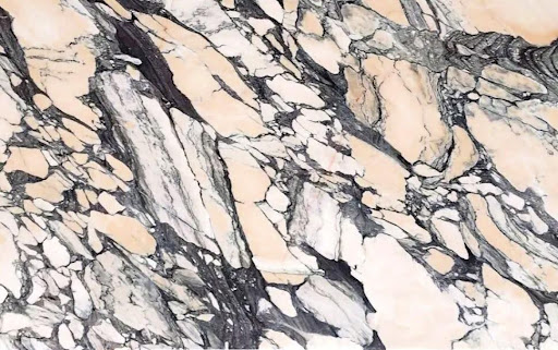 A close-up of an Arabescato pink marble slab