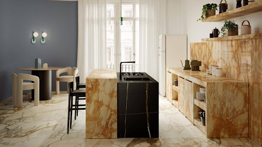 A kitchen with Marazzi Calacatta Vena Vecchia worktops and contrasting Sahara Noir Island