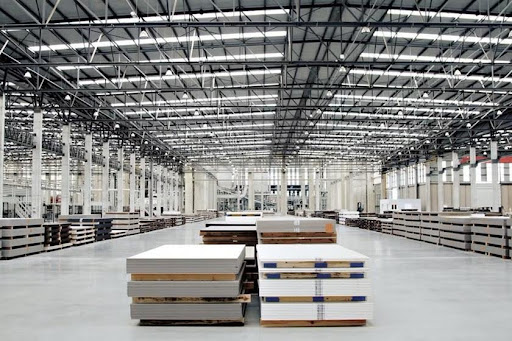 A warehouse with stacks of pallets