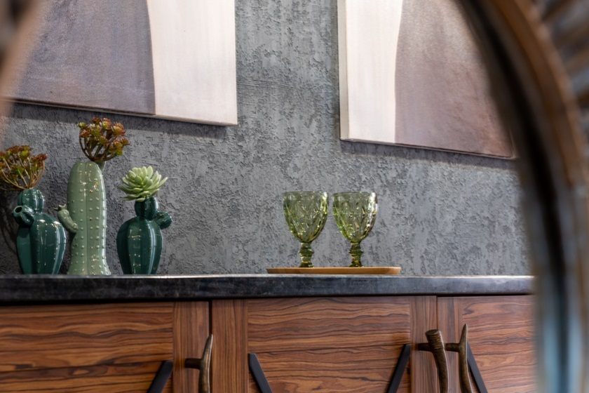 a black granite effect worktop on a wooden console 