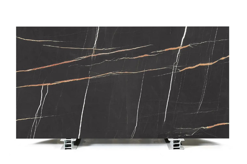 a photo of a Uniceramica Sahara Noir slab on a metal rack
