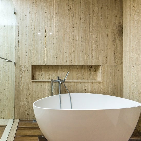 a bathroom with roman travertine wall and floors