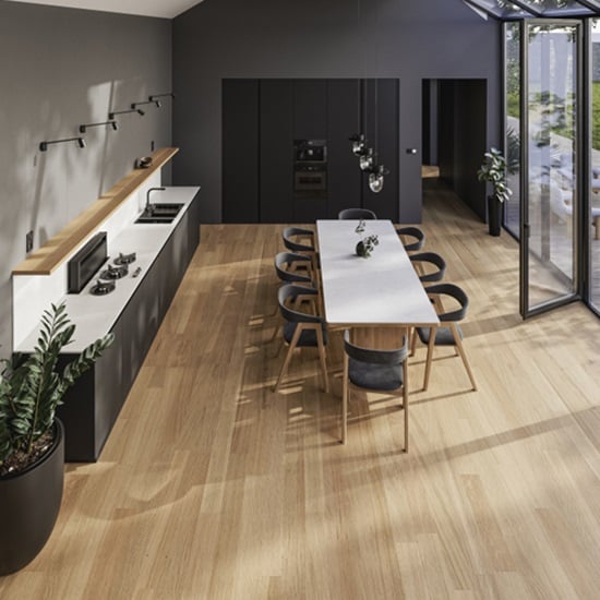 a contemporary kitchen with Technistone Morning Daisy worktops and wooden floors