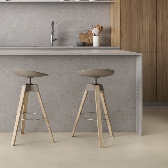 an Ascale Dune Gray kitchen island waterfall and two stools