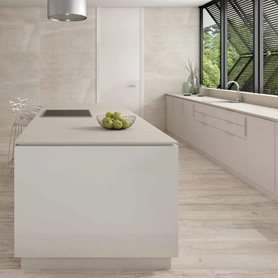 a kitchen with Ascale Cosmopolita Ivory worktops and island