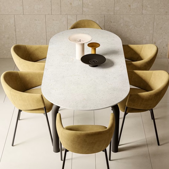 a Dekton Polar tabletop and sic green chairs